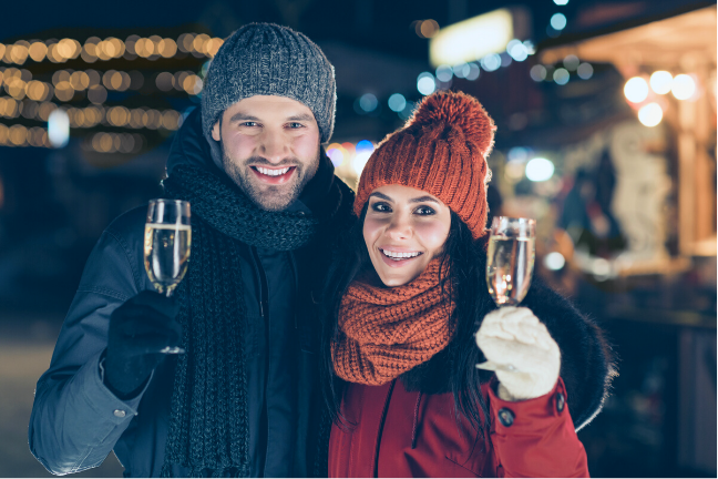 couple in winter making a toast
